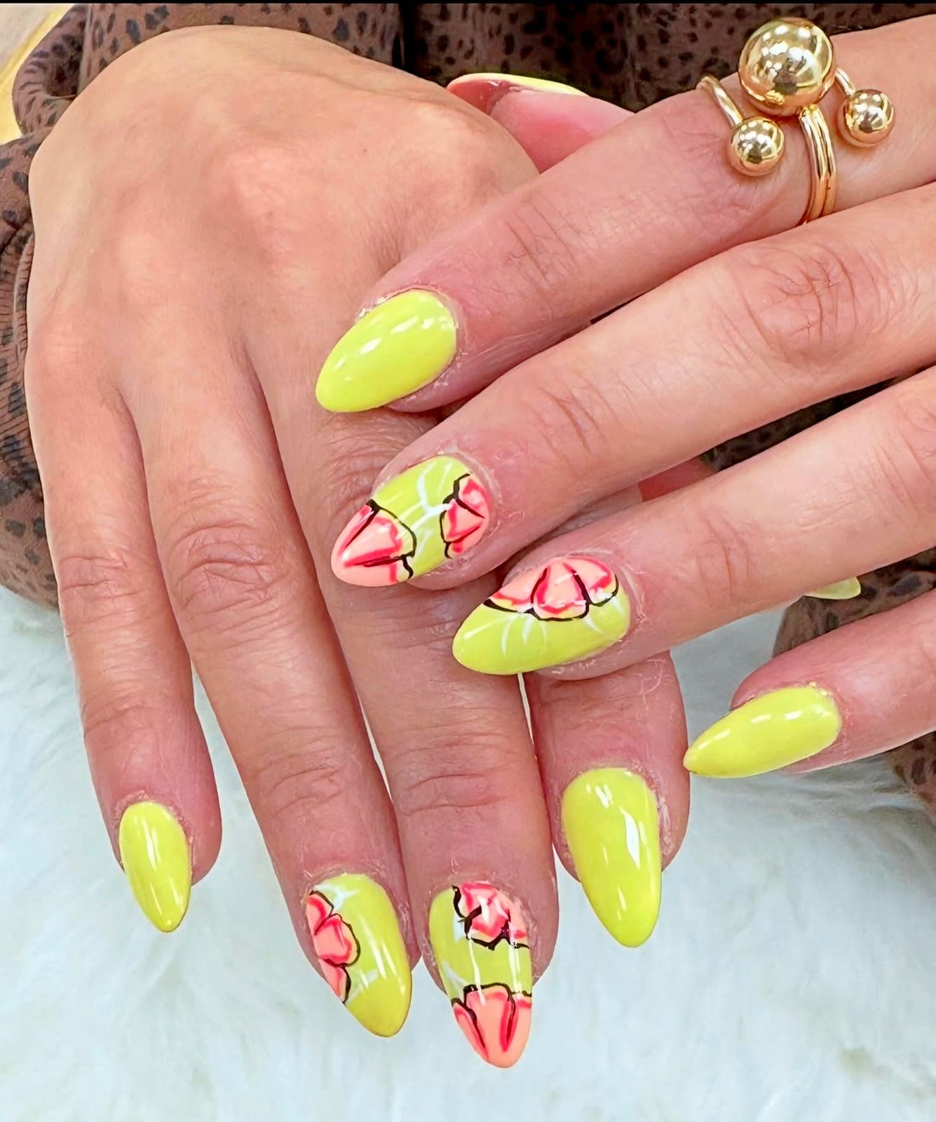 Neon yellow almond nails with hand-painted flowers